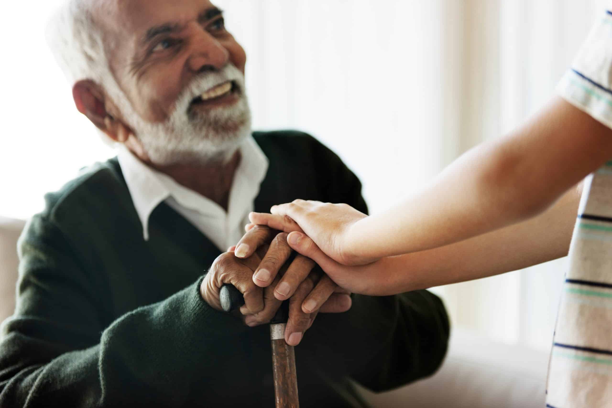 Senior man sitting talking with his relative