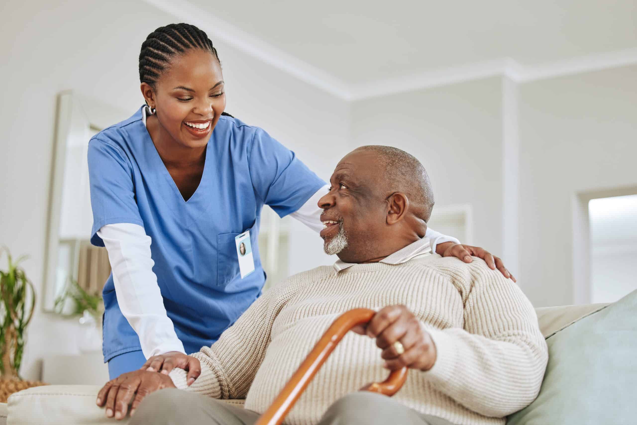 Caregiver, nurse or senior black man on a couch, retirement or help with healthcare or walking stick